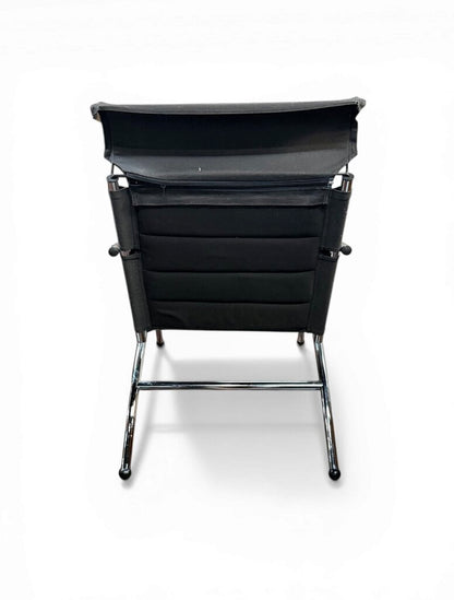 Black And Chrome Lounge Chair And Ottoman