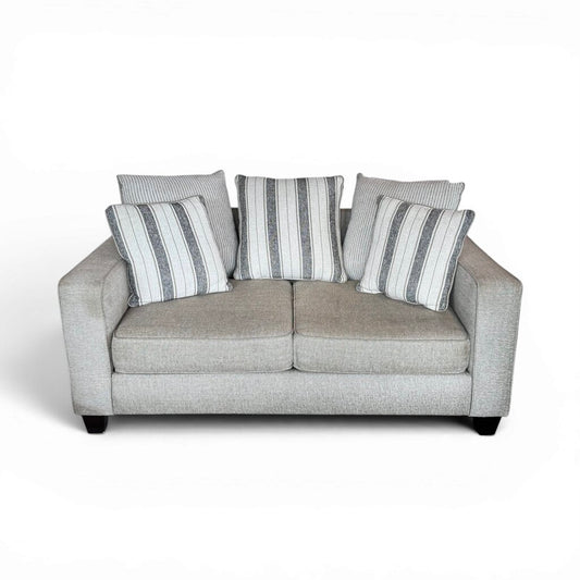 Tan 2 Seater Couch with Striped Pillows