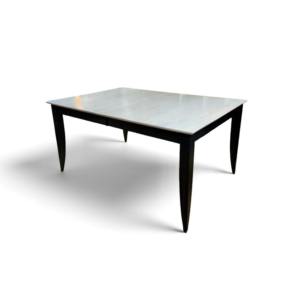 White Maple Dining Table With 2 Leaf Extensions and 6 Black Upholstered Chairs