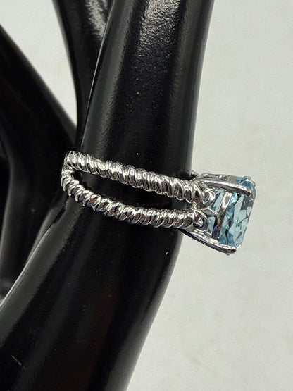 Blue Topaz Solitaire in Sterling Silver setting size 6 /ro