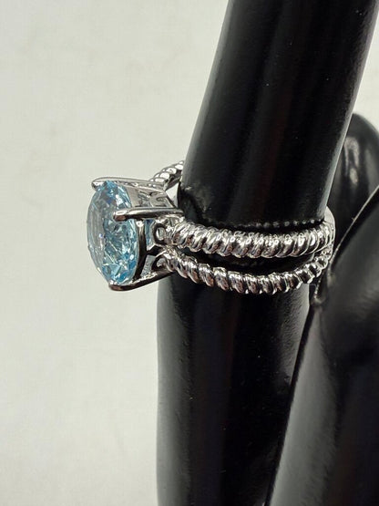 Blue Topaz Solitaire in Sterling Silver setting size 6 /ro
