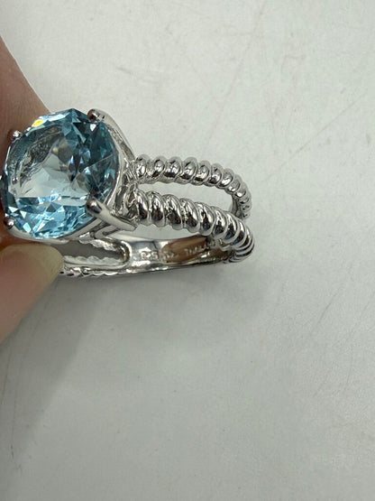 Blue Topaz Solitaire in Sterling Silver setting size 6 /ro