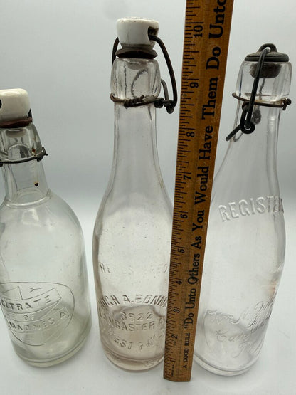 Set of 3 Antique Embossed Glass Bottles with Stoppers /ro
